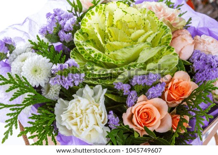 Bright buketny composition from fresh flowers, the white background
