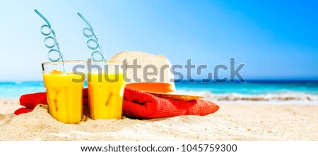 Summer photo of beach and orange juice 
