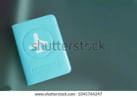 Passport in blue cover with white airplane 