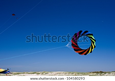 hang gliders with blue sky background