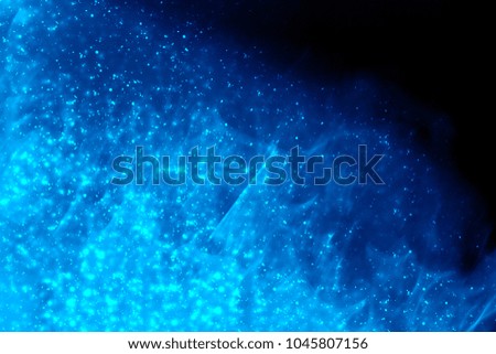 Abstract background of blue water drops light bokeh circles. Bright round defocused lights. Can use for poster, website, brochure, print.