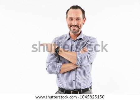 Image of happy handsome adult businessman isolated over white background. Looking camera pointing.