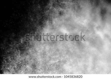 Abstract splashes and texture of white water, rain or snow on on dark background.