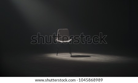 A black chair on dark background, low key and spotlight. Royalty-Free Stock Photo #1045868989