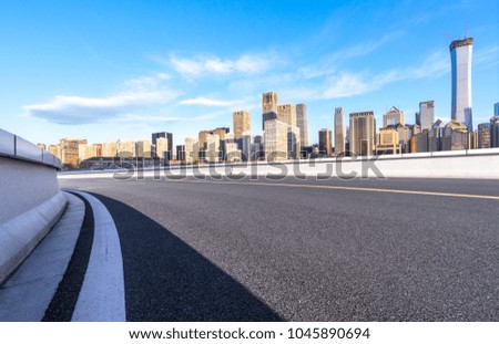 empty asphalt road with panoramic cityscape.
