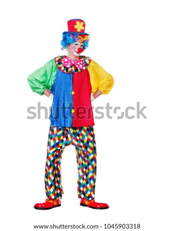 Full length picture of a standing clown in a hat