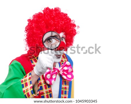 Clown looking through the magnifier closeup picture