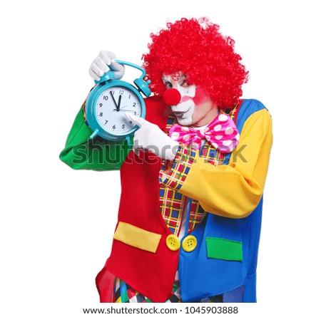 Clown holding in a hand alarm clock  