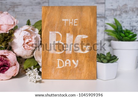 Wooden board with motivational text the big day
