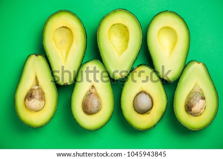 Avocado flat lay on green pastel background. Food concept