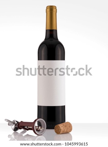 Isolated Red Wine Bottle in a White and Wood Background, fresh and Clean with Gold Capsule with White Label