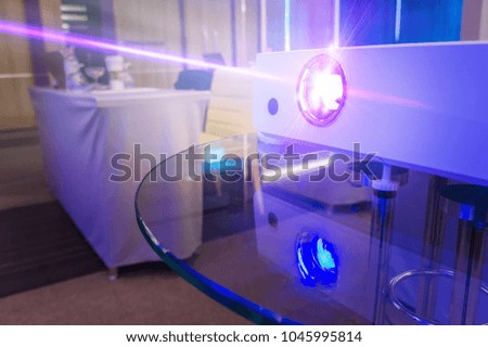 projector in conference room with blurry people background, projector for presentation in blue light tone