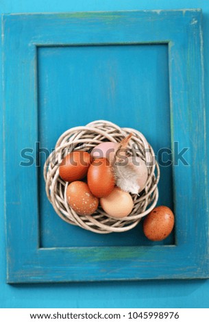 eggs in a nest on a wooden background, close-up