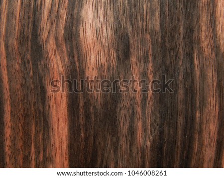 Wood surface of ebony Eben Makassar. Decorative material for furniture Royalty-Free Stock Photo #1046008261