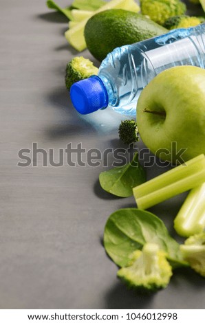 Fresh healthy green vegetables and mineral water. Health, sport and diet concept.