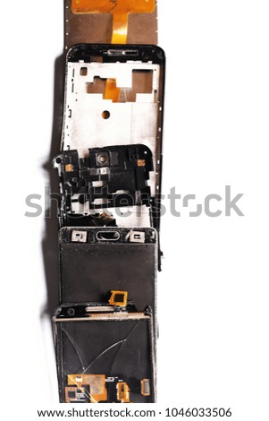Parts of damaged broken smartphones on white background top view. 