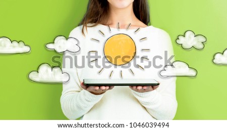 Sunny Day with woman holding a tablet computer