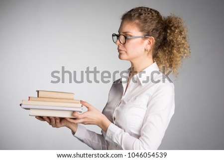 Young business woman on gray background