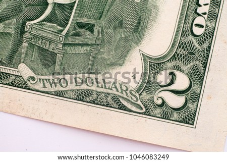 Details on two dollar banknotes.