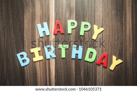 Happy Birthday word on the wood background.