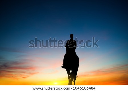 silhouette of the rider against the sunset sky.the journey on horseback.