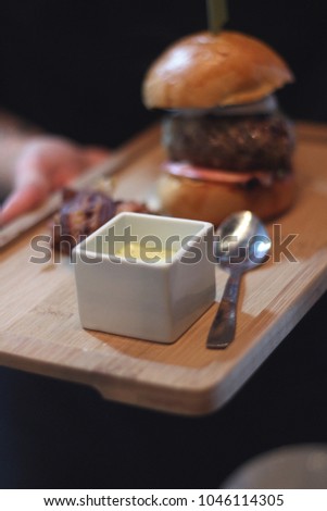 Gourmet hamburger being served