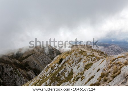 mountain view with thick clouds down to the lowland in Montenegro