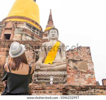 Tourist wearing hat Ayutthaya World Heritage Tourism Legend of Thailand with over 800 years Thailand