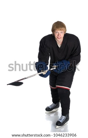 A hockey player makes a throw. The concept of sport and a healthy lifestyle. Isolated on white background.