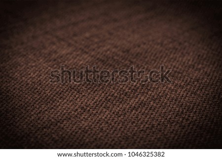 Brown fabric texture. Abstract background, empty template. Selective focus.