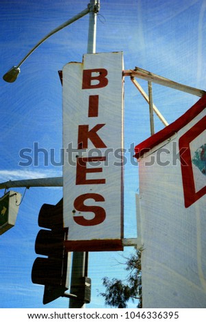aged and worn vintage bike sign                              