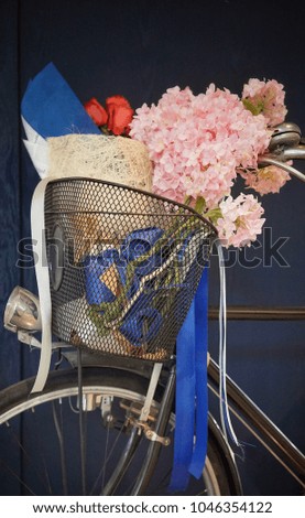 Flower bouquet on basket of vintage bicycle at Bangkok,Thailand