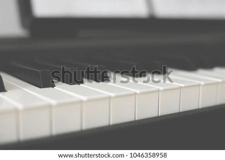 Piano keyboard background with selective focus.