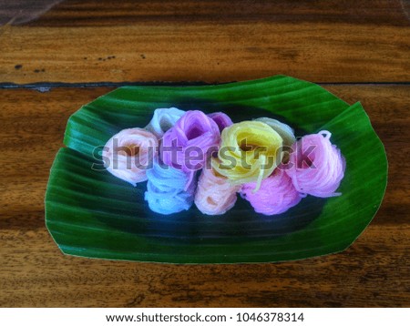 colourful rice vermicelli on banana leaf