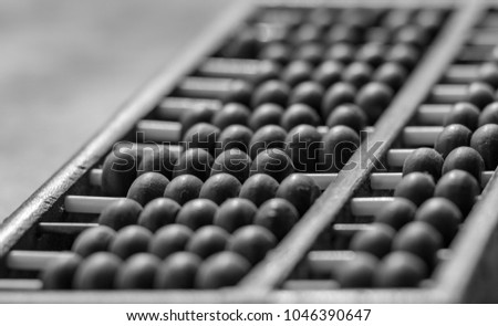Old Abacus on cement background in black and white style
