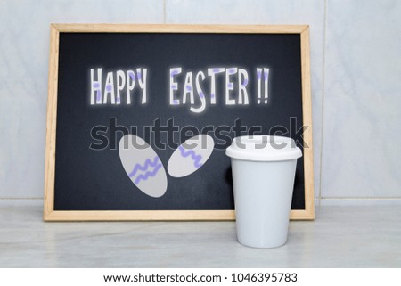 cup of coffee and easter message on blackboard
