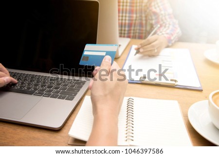 Hand of people have the freedom of shopping online or use internet banking on tablets with a credit card unlimited.