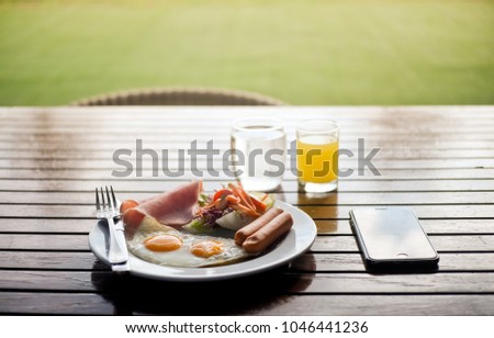 Breakfast on wood table in the morning