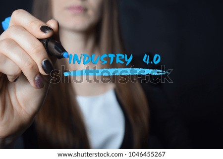 The businessman writes a blue marker inscription:INDUSTRY 4.0