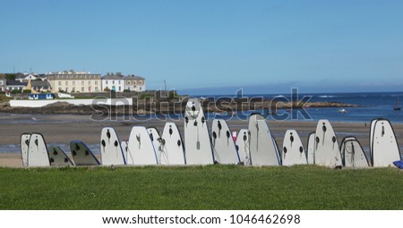 Surfboards and view to Kilkee beach in county Clare in Ireland Royalty-Free Stock Photo #1046462698