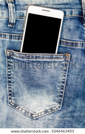 Close Up Smartphone in blue Jeans Back Pocket Bussines Fashion Stylish  Screen Copy Space White Mobile Denim Hipster  Royalty-Free Stock Photo #1046463403