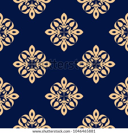 Golden floral ornament on dark blue background. Seamless pattern for textile and wallpapers