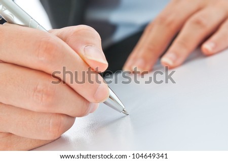 business people writing the pen on blank paper Royalty-Free Stock Photo #104649341
