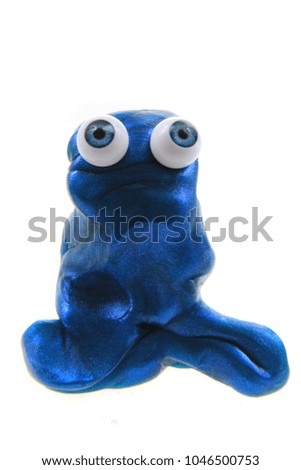 plasticine figure with blue eyes isolated on the white background