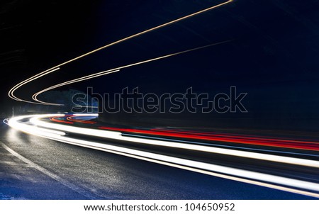 car light trails in the tunnel. Very art image . Long exposure photo taken in a tunnel below Veliko Tarnovo