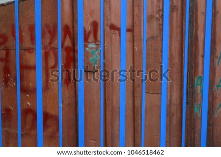 Fence in the city street. Summer and autumn background 