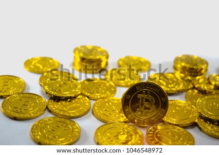 Lots of gold Bitcoins, On a white background with a digital currency concept.
This is the symbol of the modern financial world.