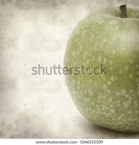 textured old paper background with green apples