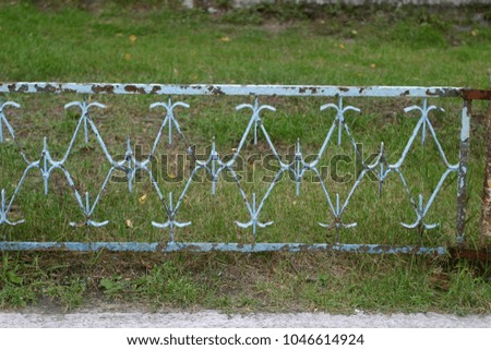 Fence in the city street. Summer and autumn background  