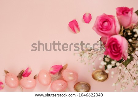 Pink and Gold Easter Eggs. Pastel Easter Concept with Eggs, Flowers and Feathers. Punchy Pastels. Copy Space